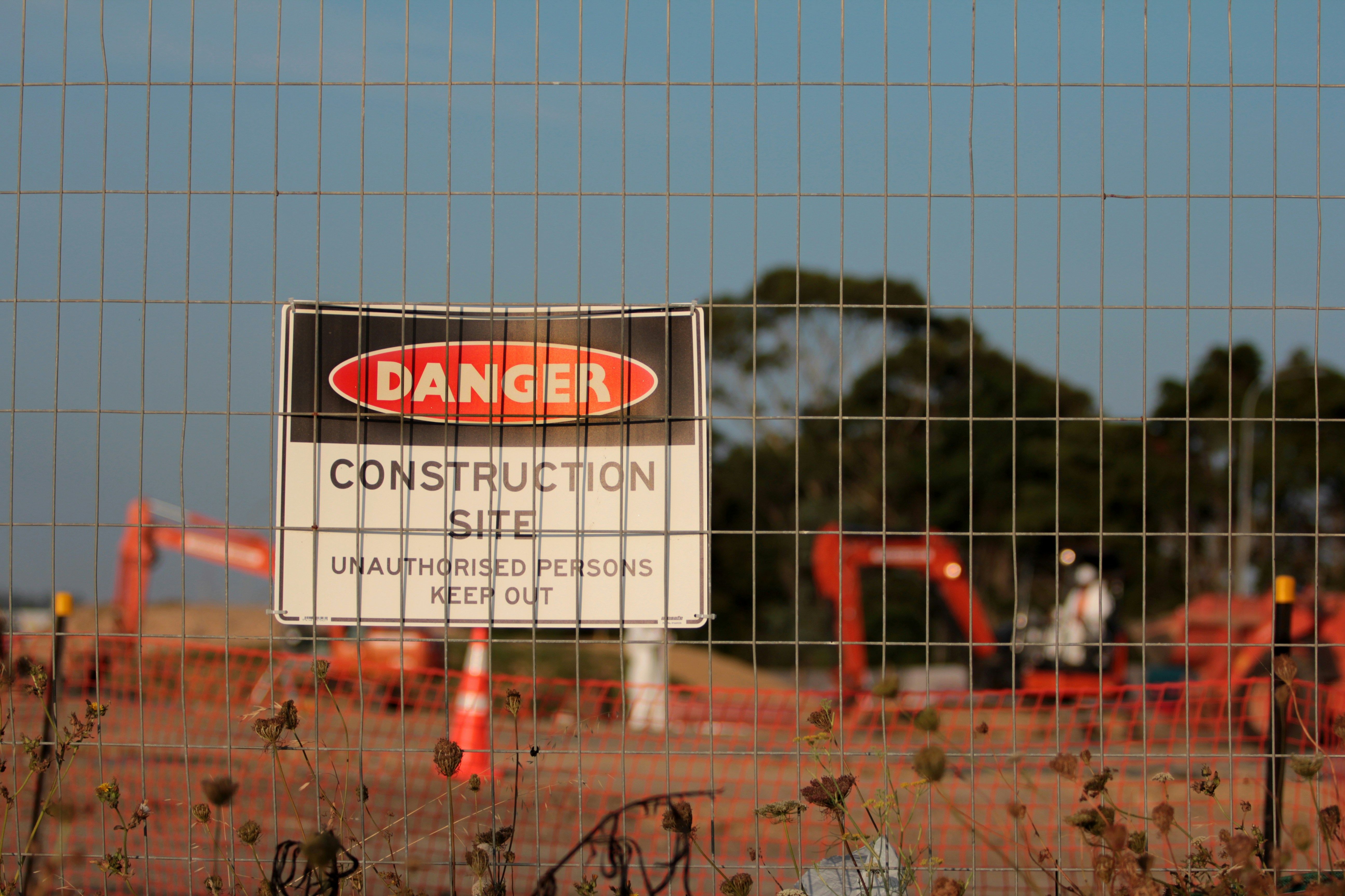 Illustrated health, safety, and environment board with compliance checklist and protective equipment.
